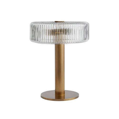 A stately Gatsby Edition fluted glass table lamp with a substantial ribbed brass base and hand-pressed glass shade.
