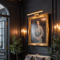 16" Wireless Brass Picture Light illuminating a classical portrait in a stately library; battery-powered art lighting with a CRI 90+ warm glow and brushed gold finish.